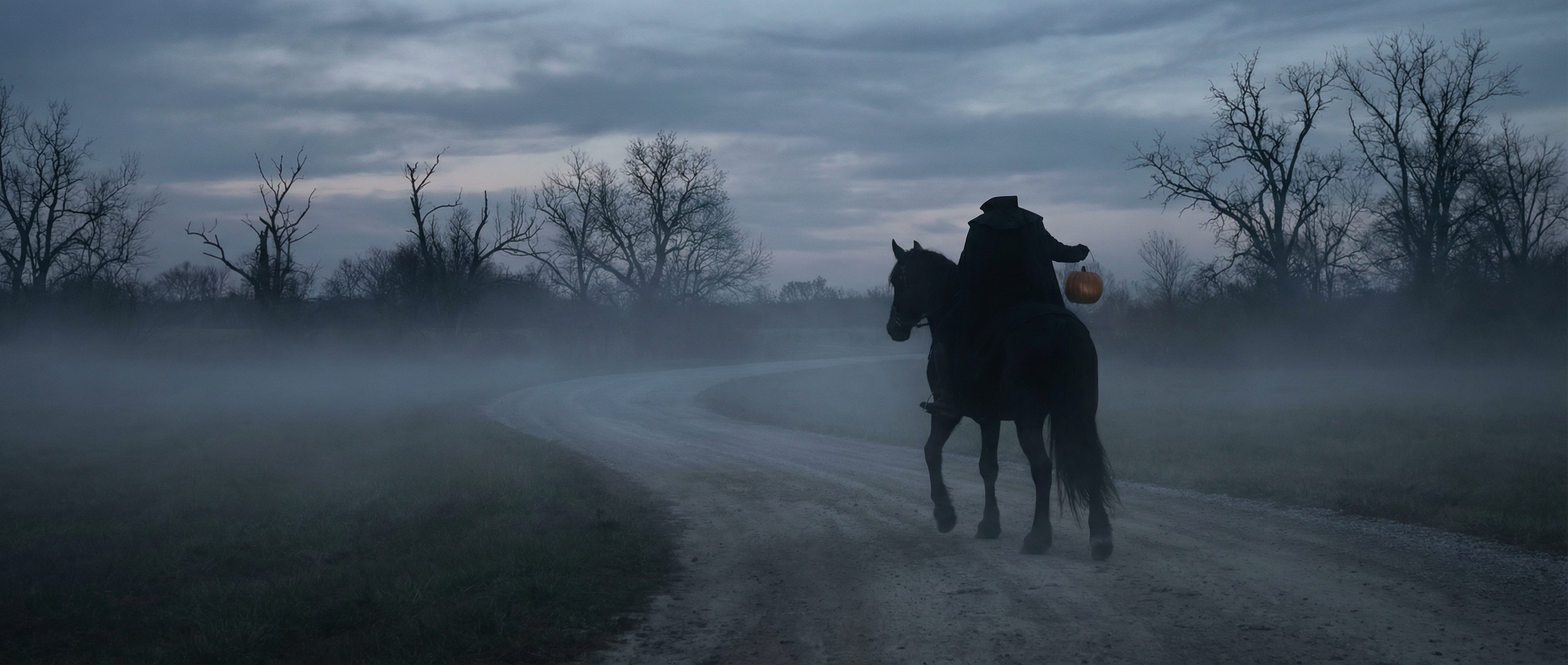 Dark road with silhouette of rider and horse